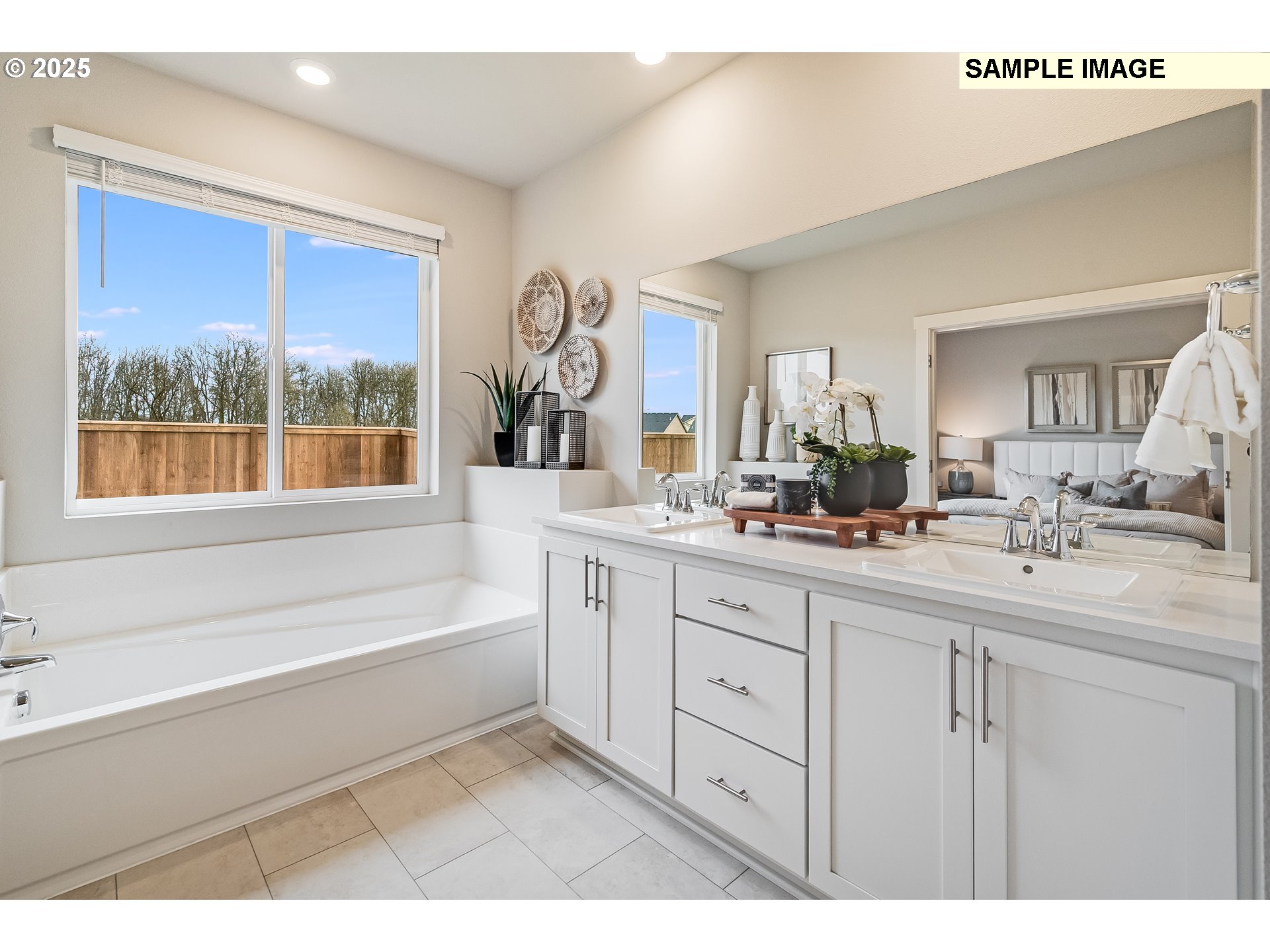 4327 Hackamore Court Southeast Albany, OR 97322 - Photo 13 of 25 a bathroom with a bathtub a double vanity sink and mirror
