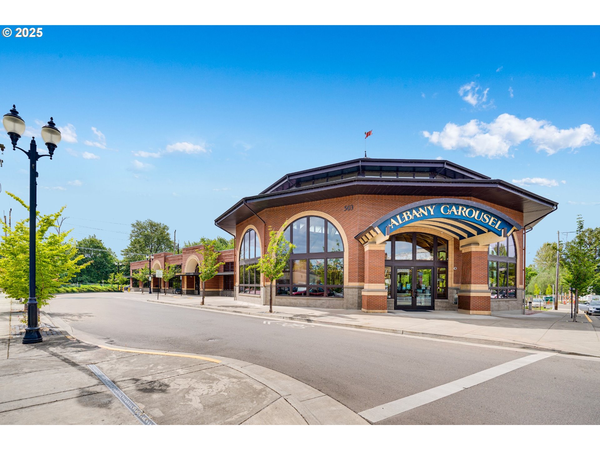 4327 Hackamore Court Southeast Albany, OR 97322 - Photo 24 of 25 a man sitting on a bench in front of a building