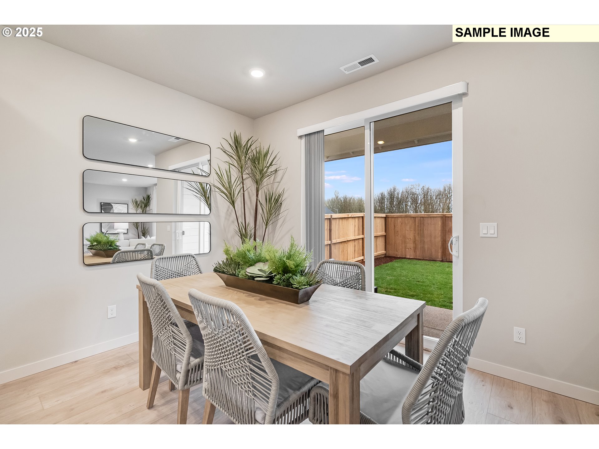 4327 Hackamore Court Southeast Albany, OR 97322 - Photo 8 of 25 a view of a dining room with furniture and a potted plant