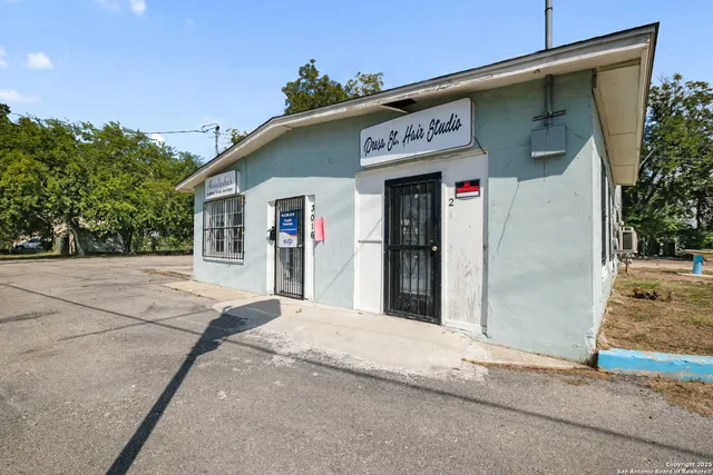 a view of a house with a street