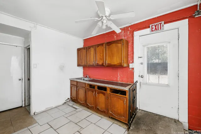 a kitchen with stainless steel appliances granite countertop a stove and a microwave