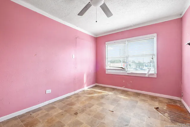 an empty room with windows