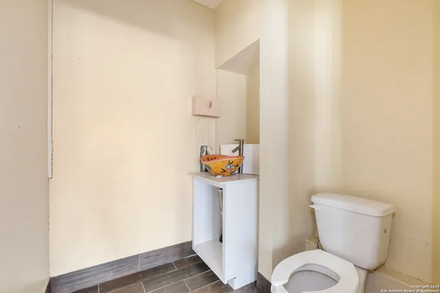 a bathroom with a toilet and a sink