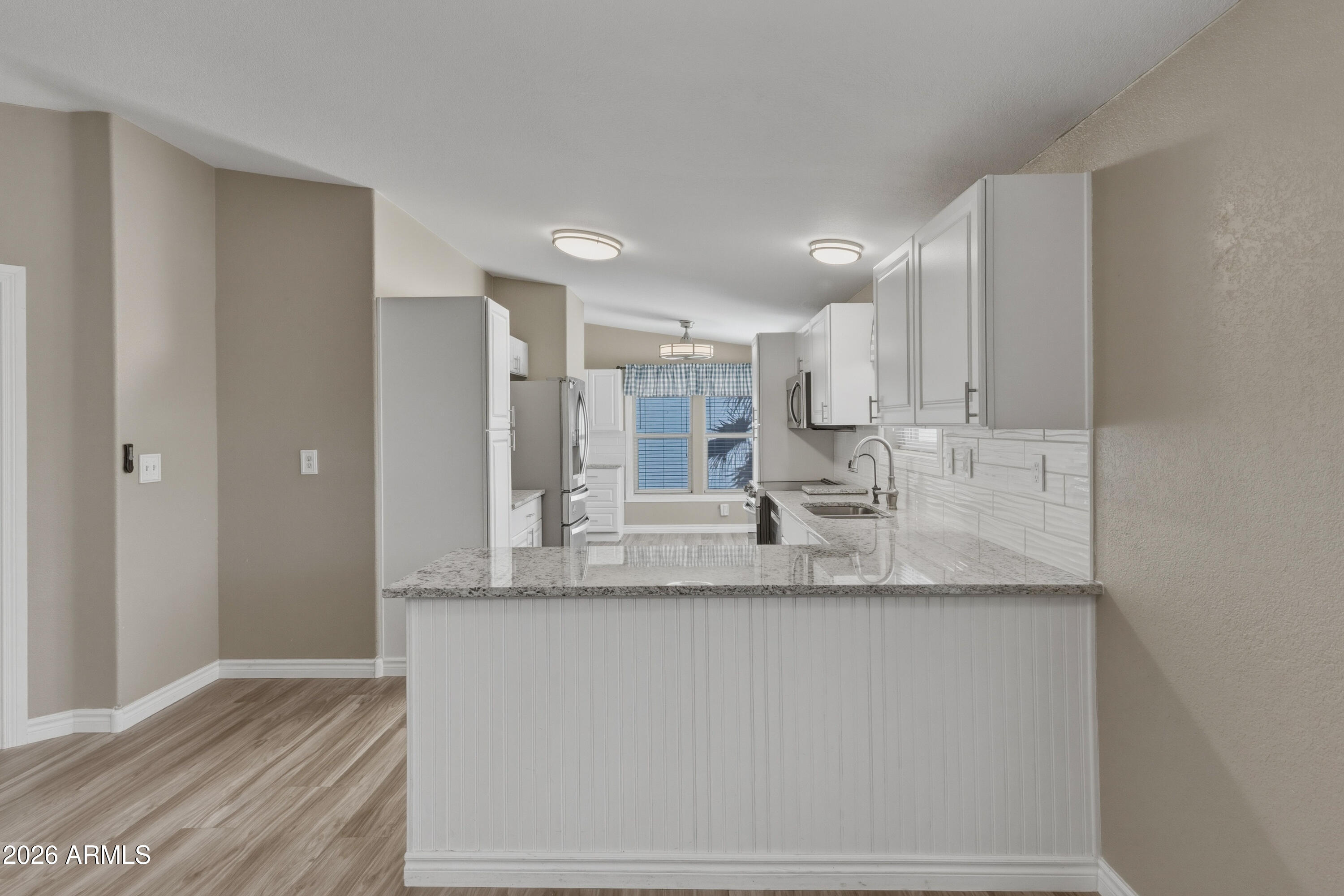 2000 South Apache Road, Unit 371 Buckeye, AZ 85326 - Photo 11 of 38 a view of a kitchen with granite countertop cabinets