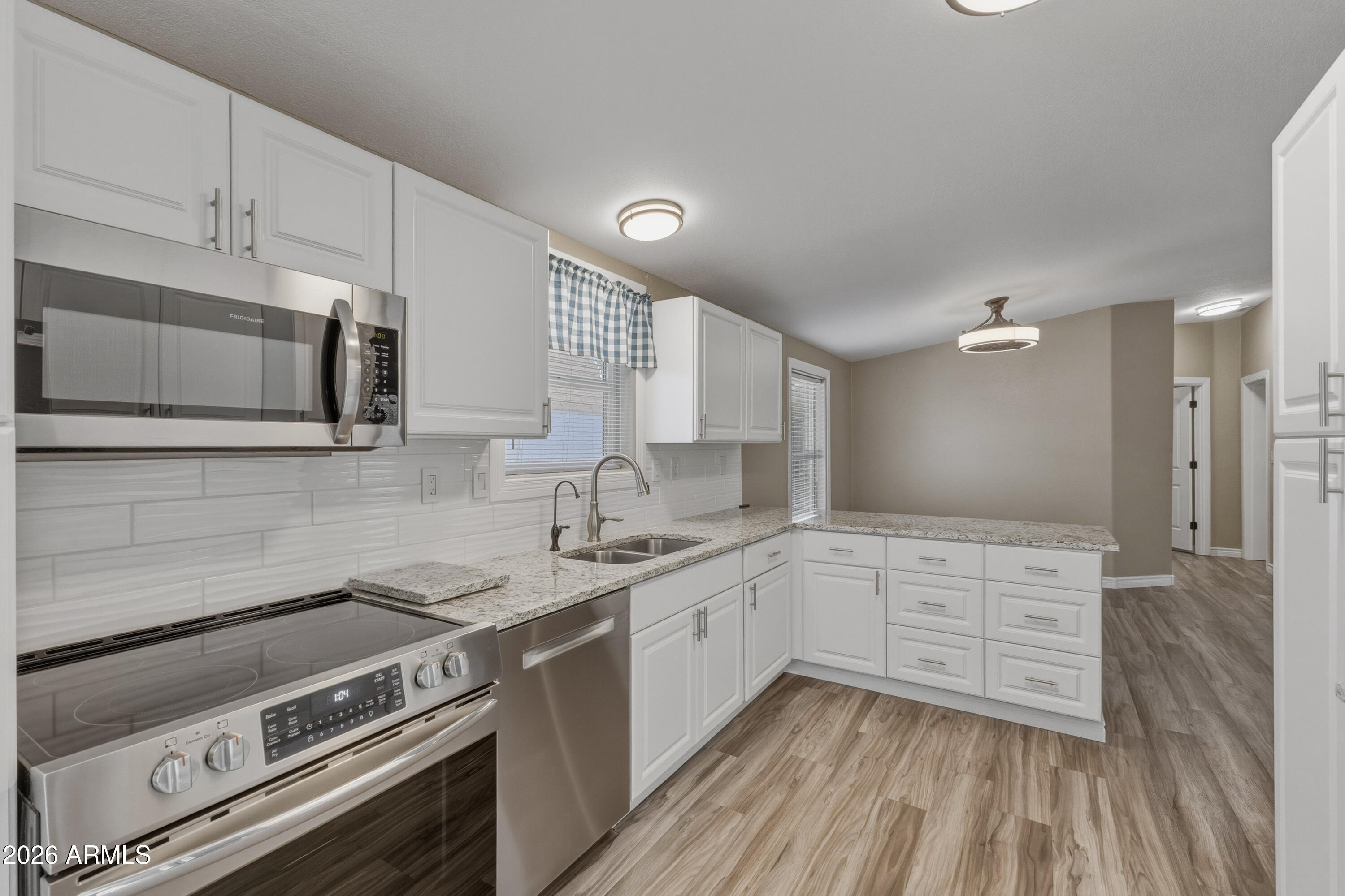 2000 South Apache Road, Unit 371 Buckeye, AZ 85326 - Photo 17 of 38 a kitchen with a stove oven and sink