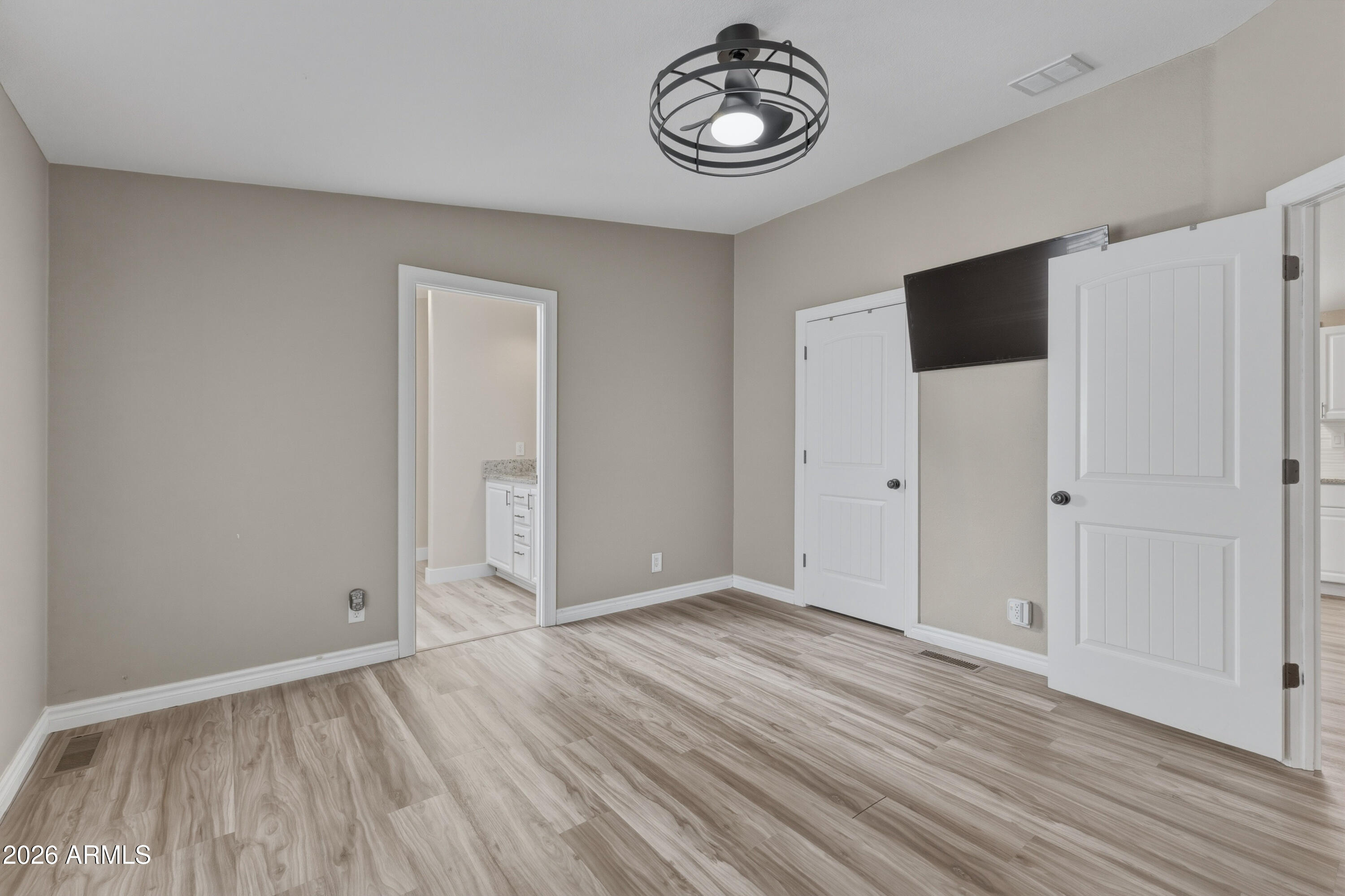 2000 South Apache Road, Unit 371 Buckeye, AZ 85326 - Photo 19 of 38 an empty room with wooden floor and window