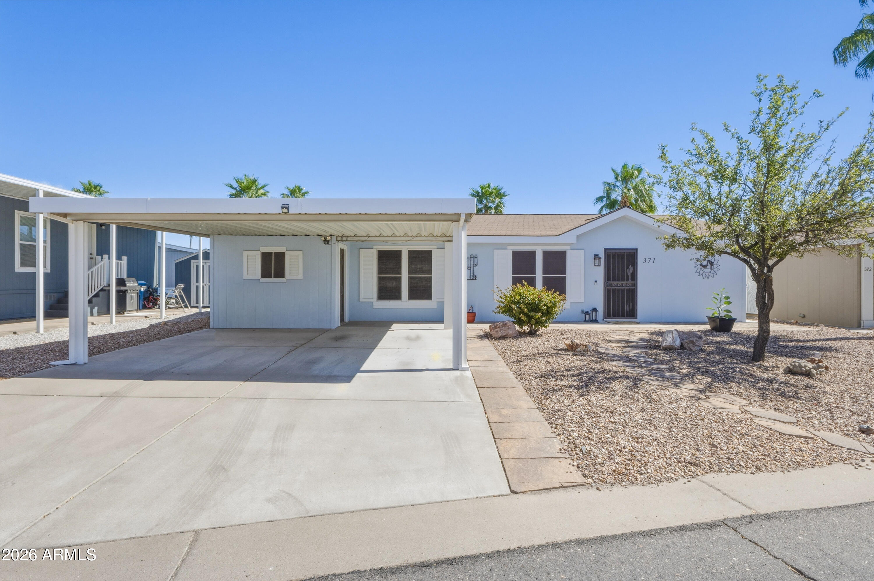 2000 South Apache Road, Unit 371 Buckeye, AZ 85326 - Photo 2 of 38 front view of a house with a yard