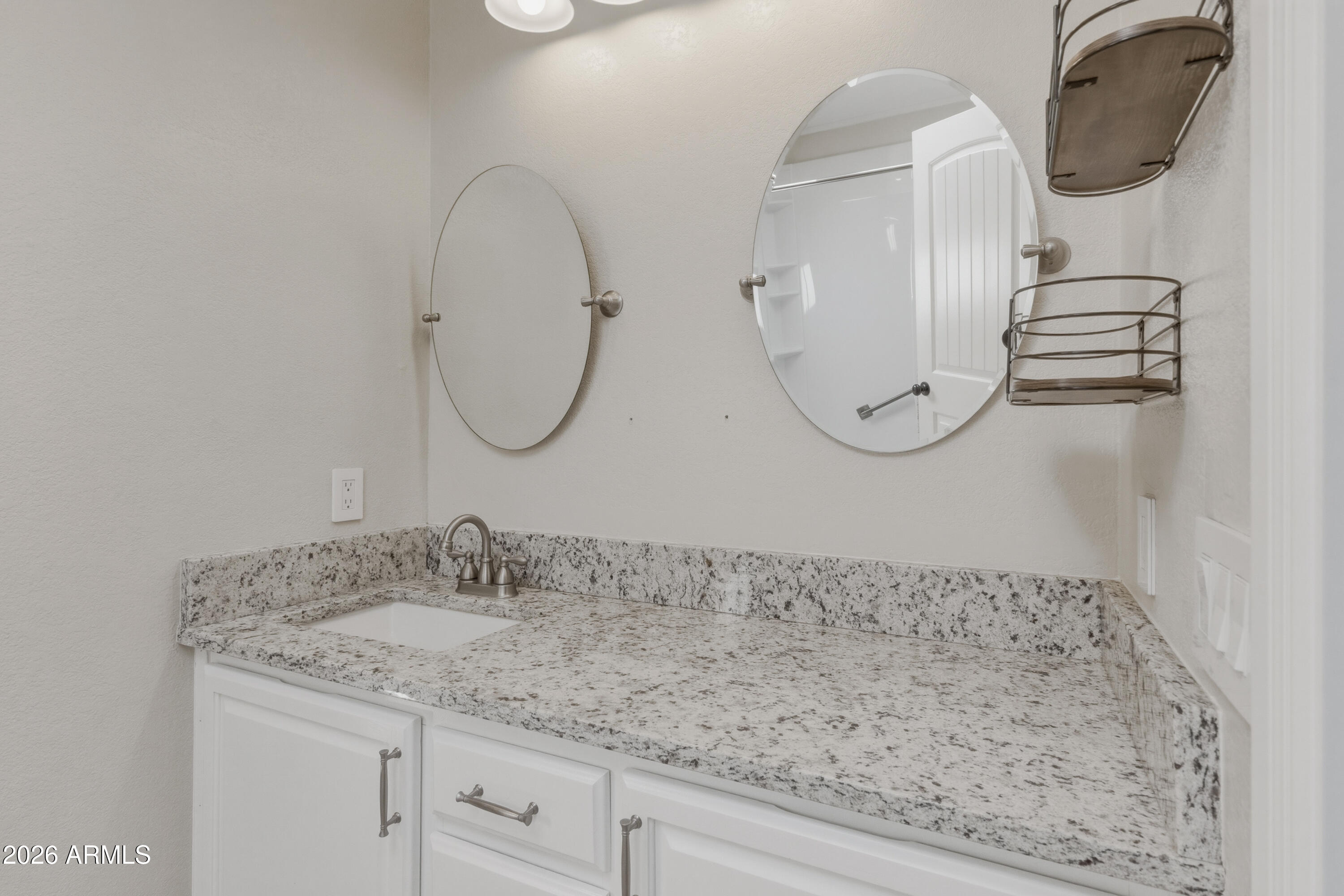 2000 South Apache Road, Unit 371 Buckeye, AZ 85326 - Photo 21 of 38 a bathroom with a granite countertop sink mirror and vanity