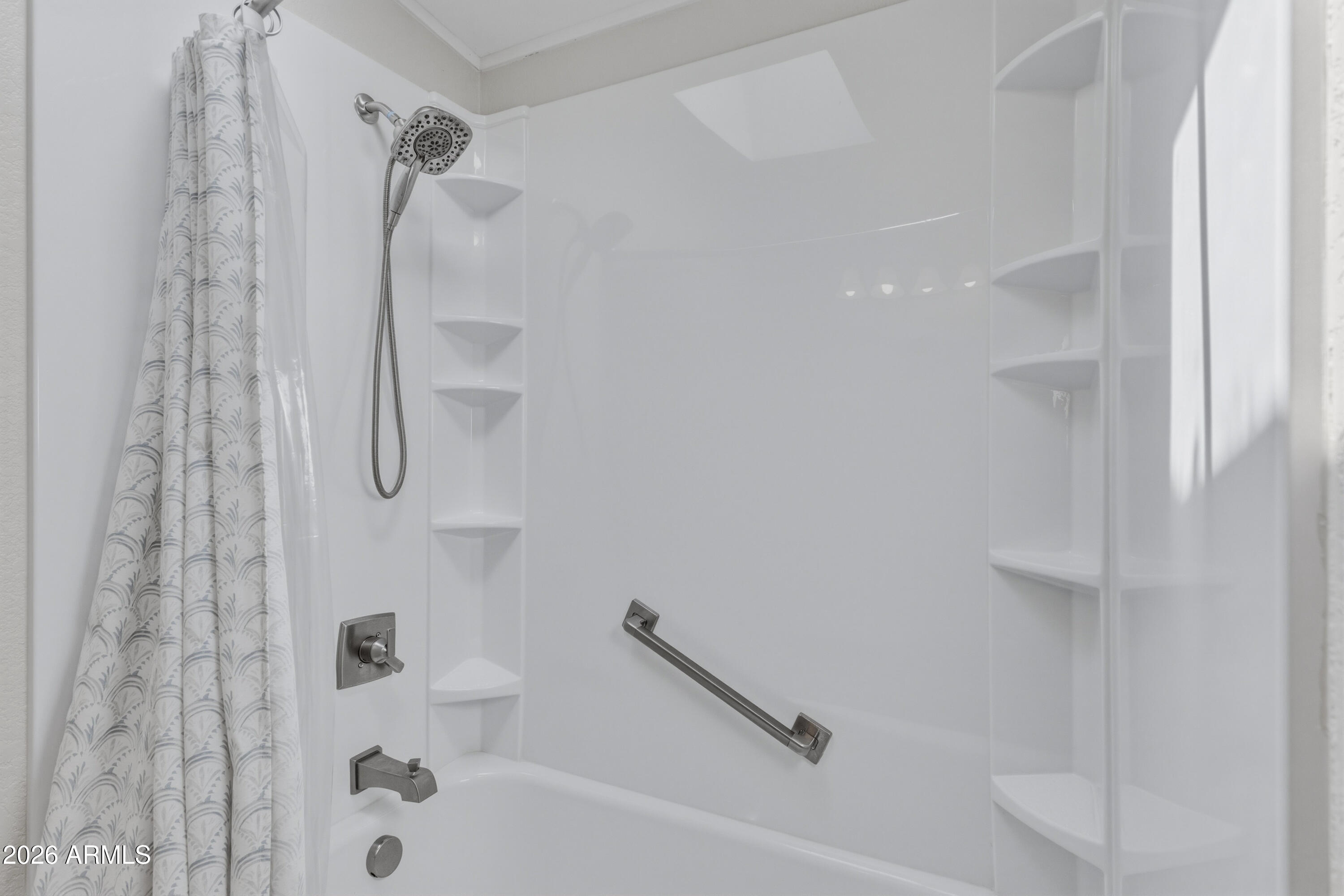 2000 South Apache Road, Unit 371 Buckeye, AZ 85326 - Photo 22 of 38 a bathroom with a shower and a bath tub
