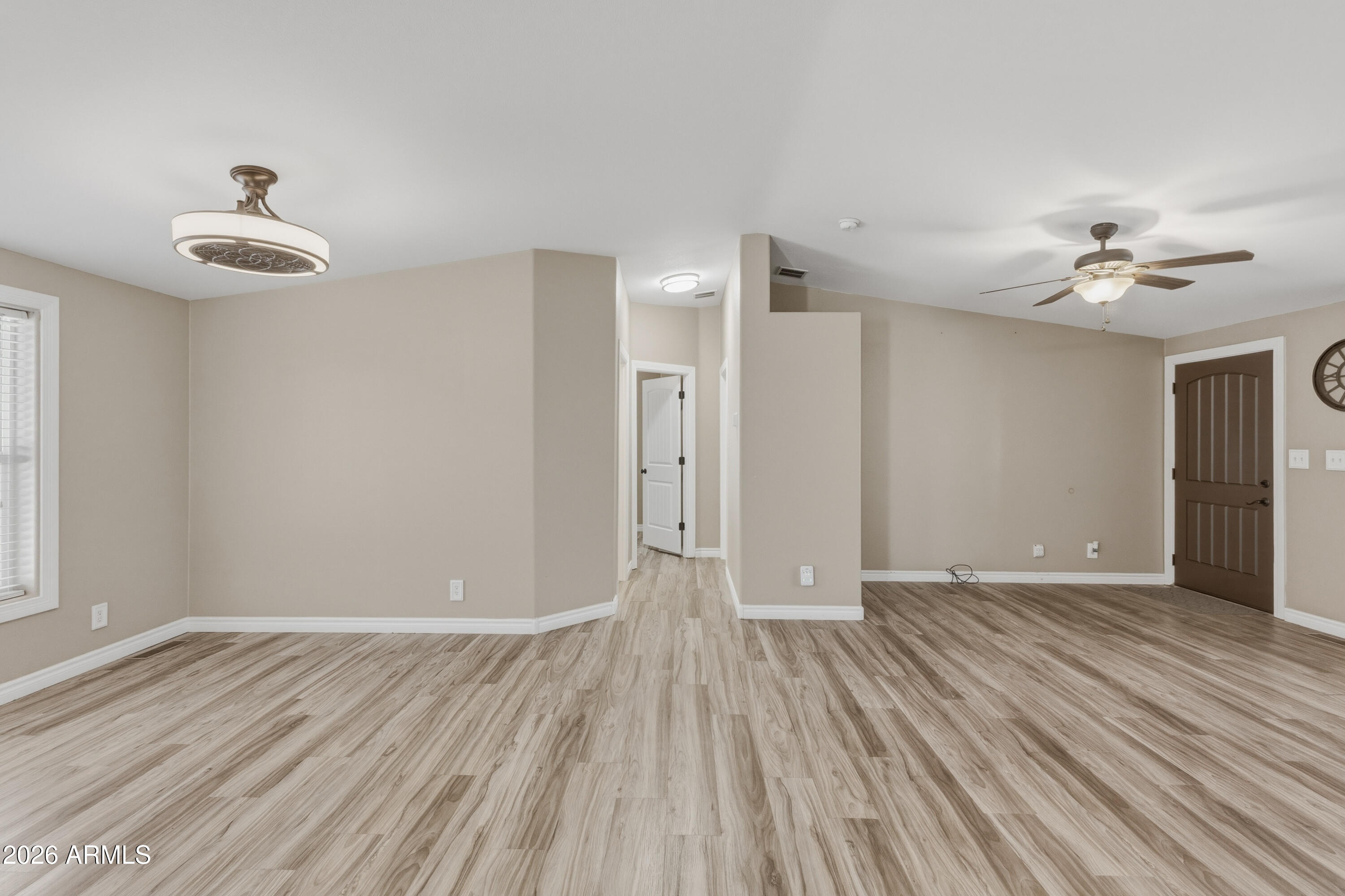 2000 South Apache Road, Unit 371 Buckeye, AZ 85326 - Photo 25 of 38 wooden floor in an empty room with a window