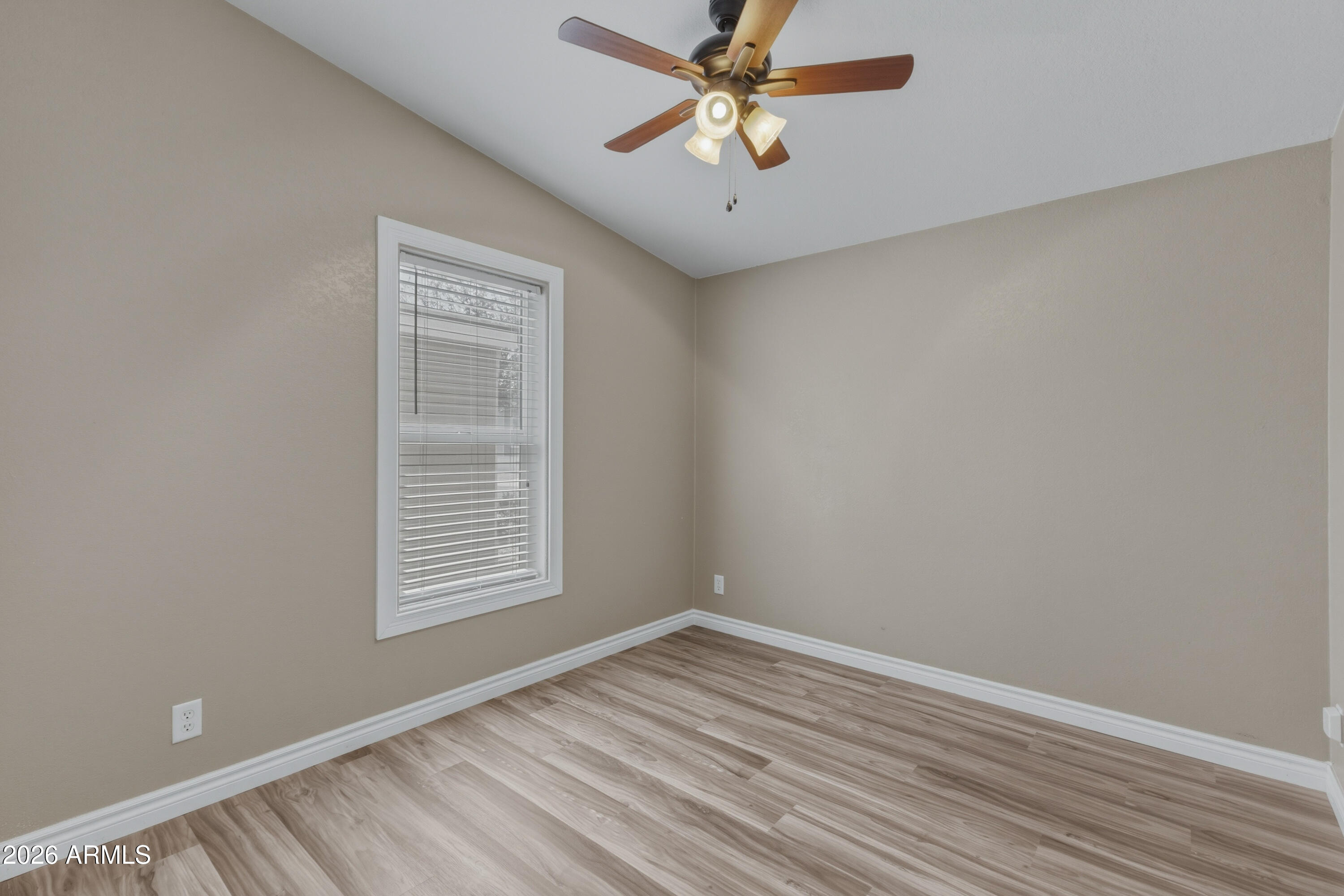 2000 South Apache Road, Unit 371 Buckeye, AZ 85326 - Photo 27 of 38 wooden floor in an empty room with a window