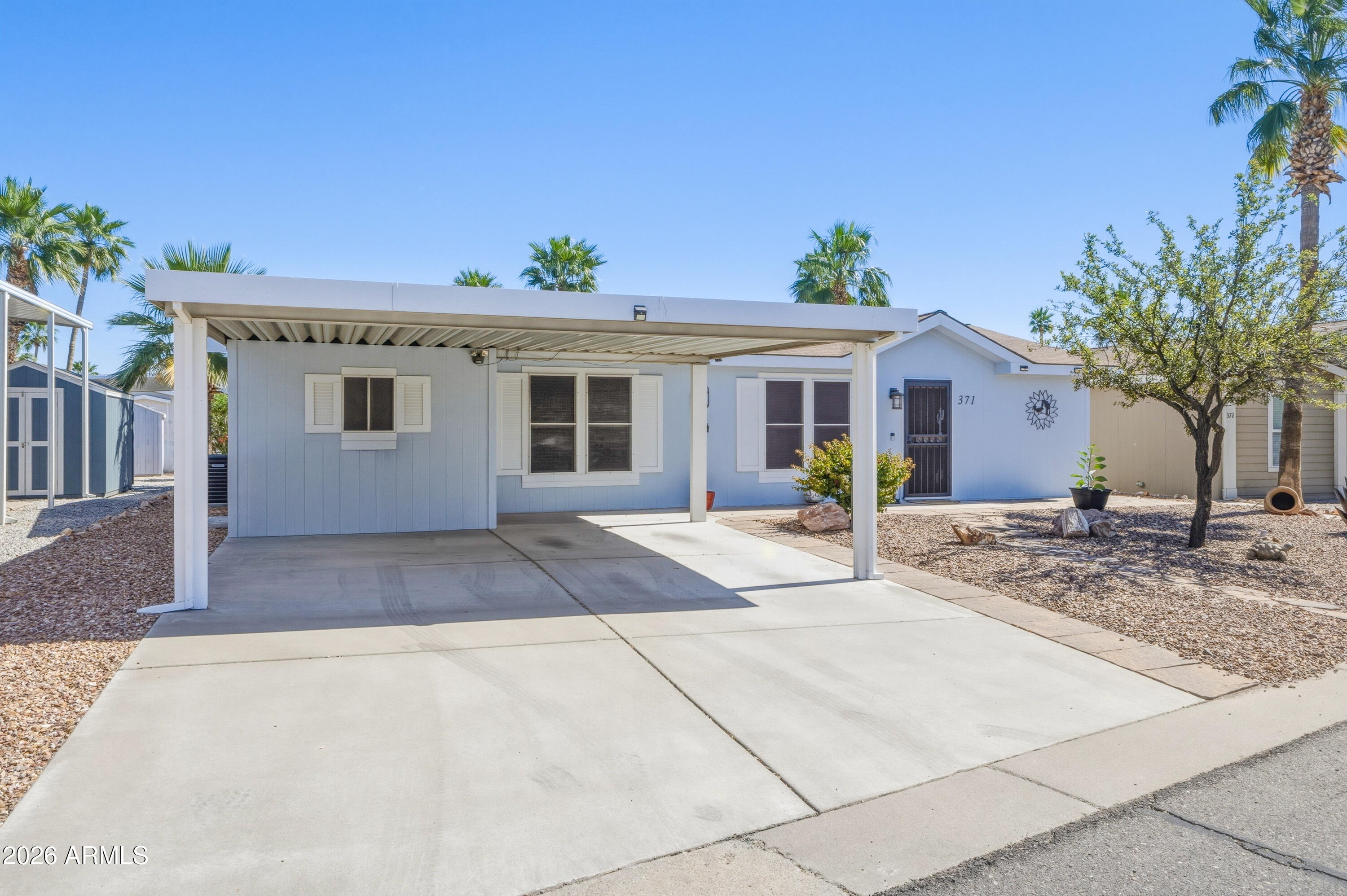 2000 South Apache Road, Unit 371 Buckeye, AZ 85326 - Photo 3 of 38 a view of a house with a patio