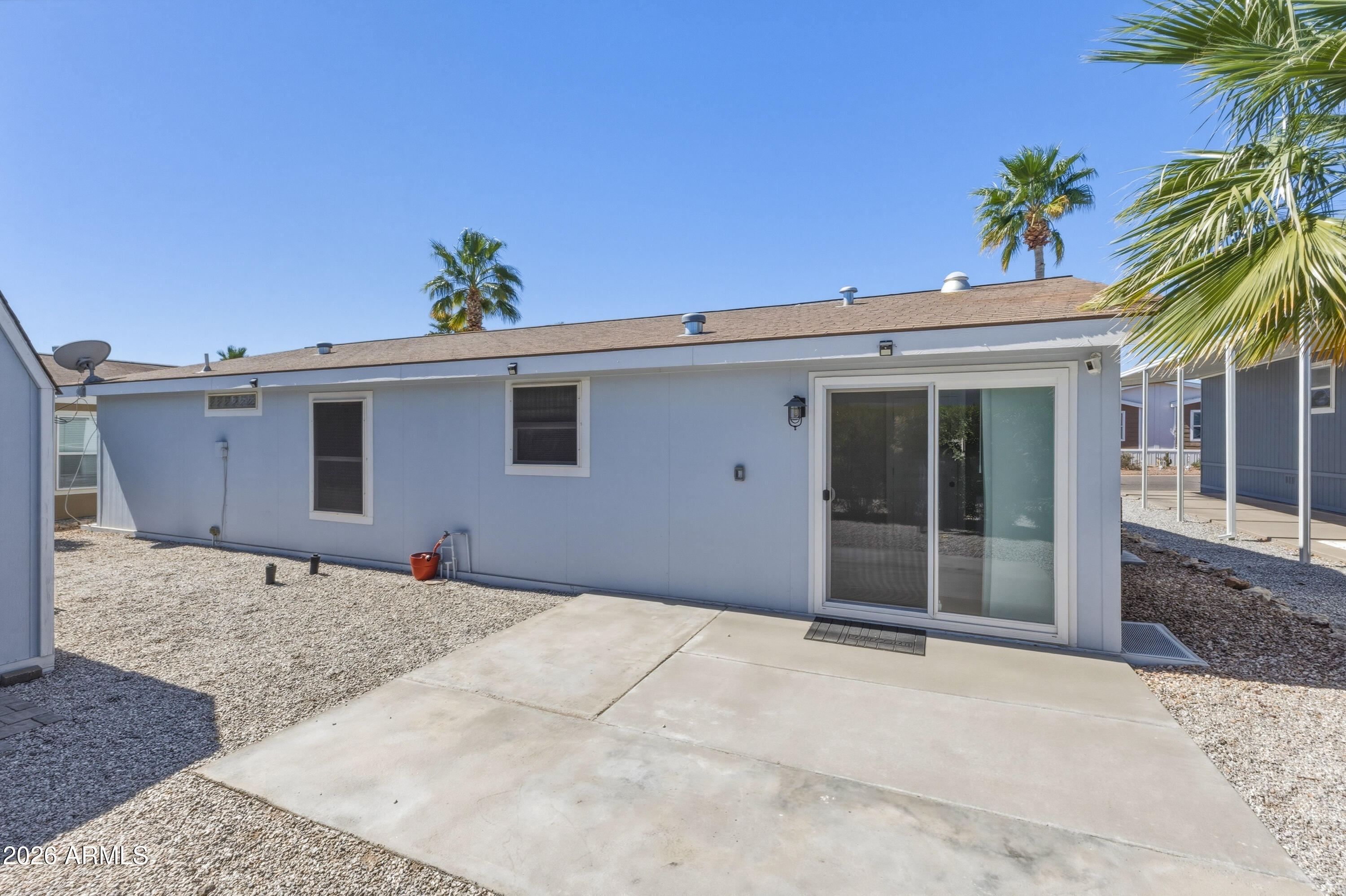 2000 South Apache Road, Unit 371 Buckeye, AZ 85326 - Photo 33 of 38 a front view of a house with a yard