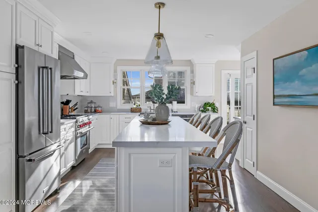 a kitchen with a table and chairs