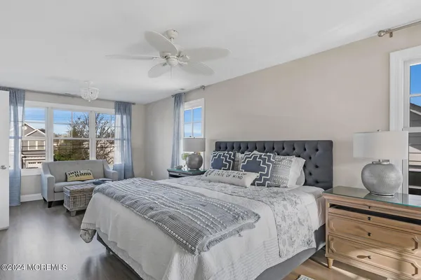 a bedroom with a large bed and a window