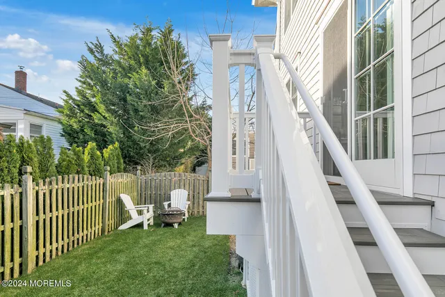 a view of a chair and tables in the balcony