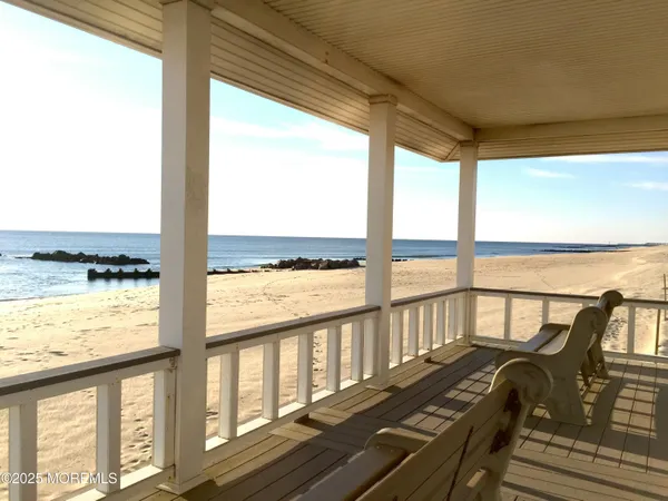 a view of a balcony with lake view and a ocean view