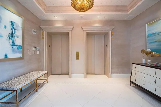 a spacious bedroom with a bed and a dresser