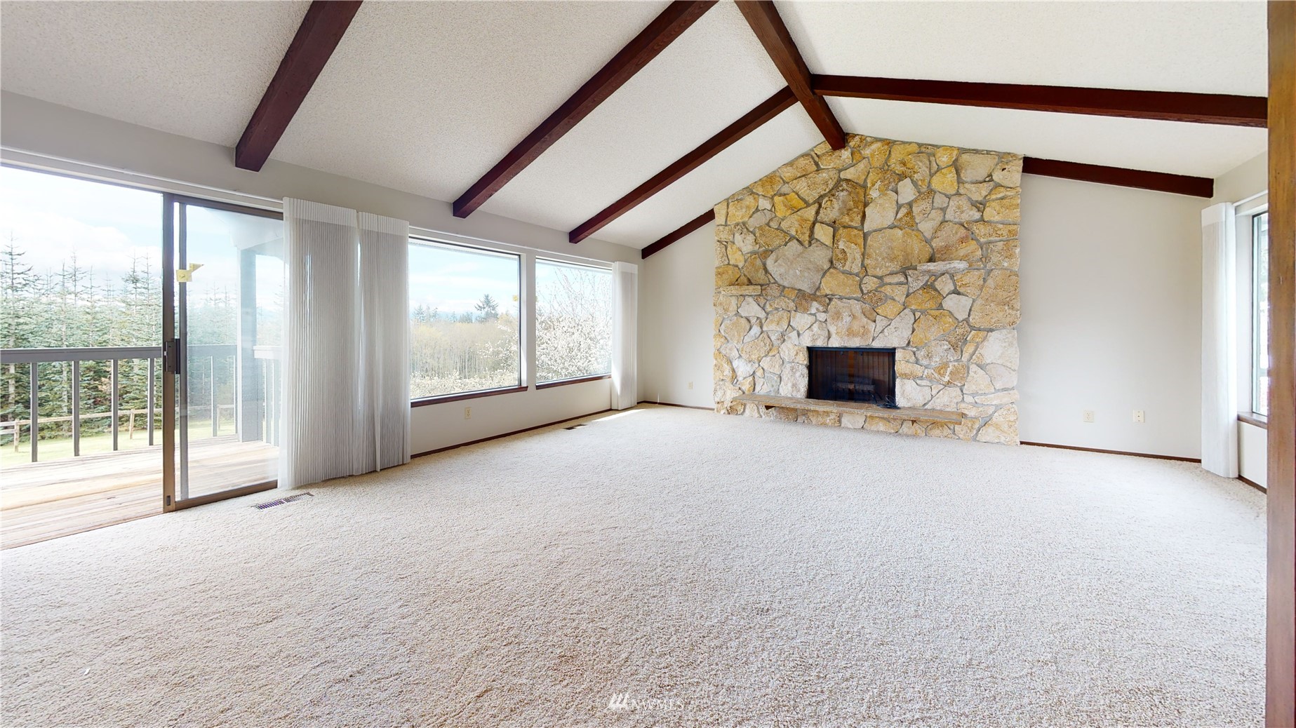 2530 Mountain View Road East Port Orchard, WA 98366 - Photo 15 of 34 a view of empty room with fireplace and windows