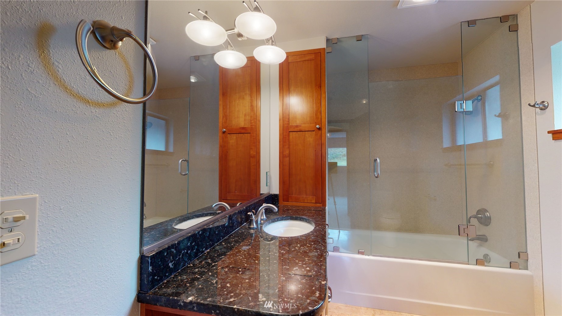 2530 Mountain View Road East Port Orchard, WA 98366 - Photo 22 of 34 a bathroom with a tub sink and mirror