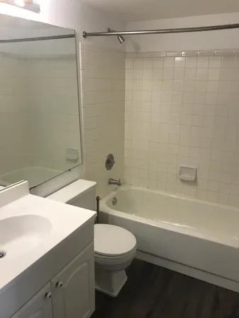 a bathroom with a toilet a sink and a shower