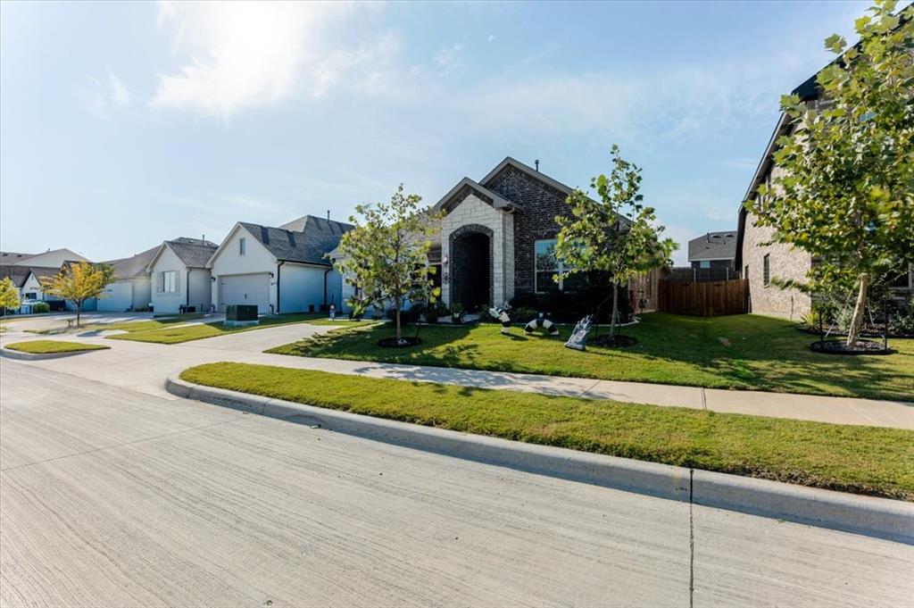 a view of a house with a yard and plants