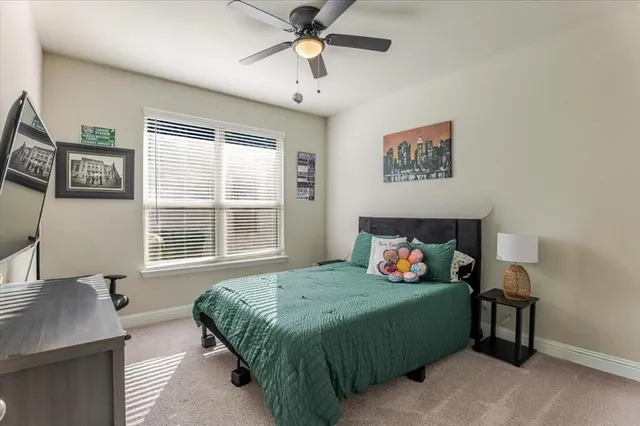 a bedroom with a bed and window