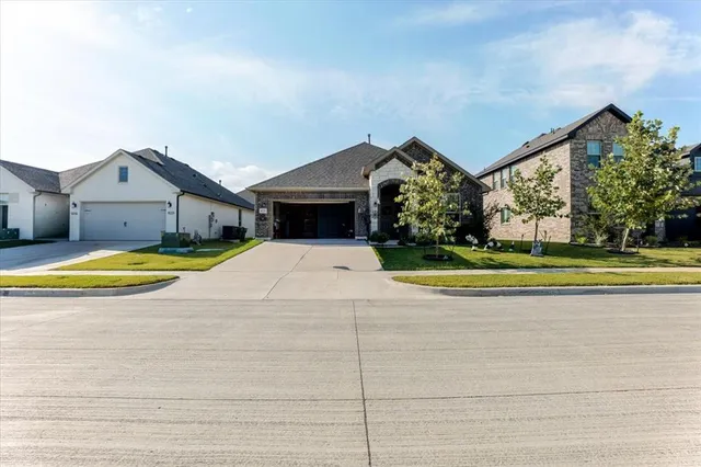 a view of swimming pool in front of house
