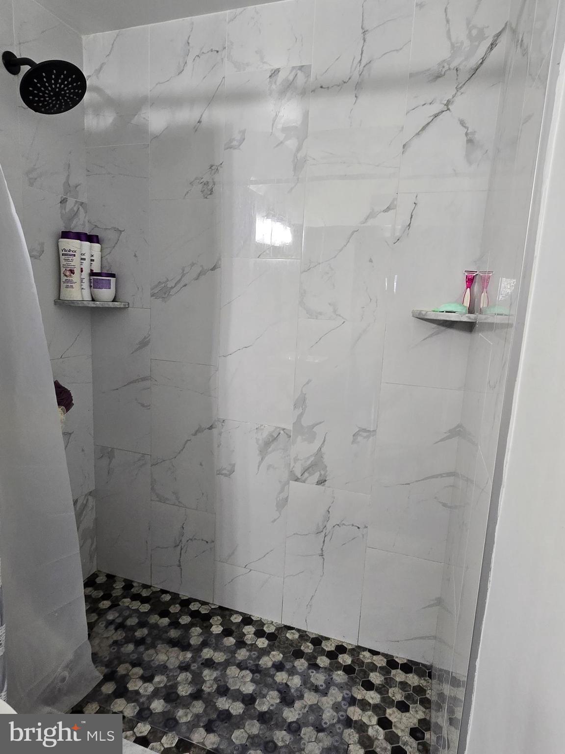7513 Saffron Court Hanover, MD 21076 - Photo 14 of 42 a bathroom with a shower