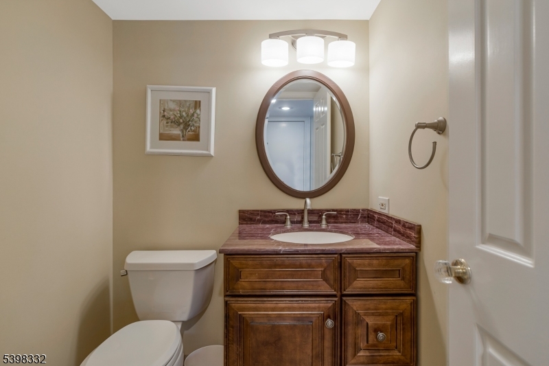 46 Eton Court Bedminster, NJ 07921 - Photo 11 of 30 a bathroom with a toilet a sink and a mirror