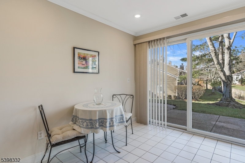 46 Eton Court Bedminster, NJ 07921 - Photo 14 of 30 a dining room with furniture and a floor to ceiling window