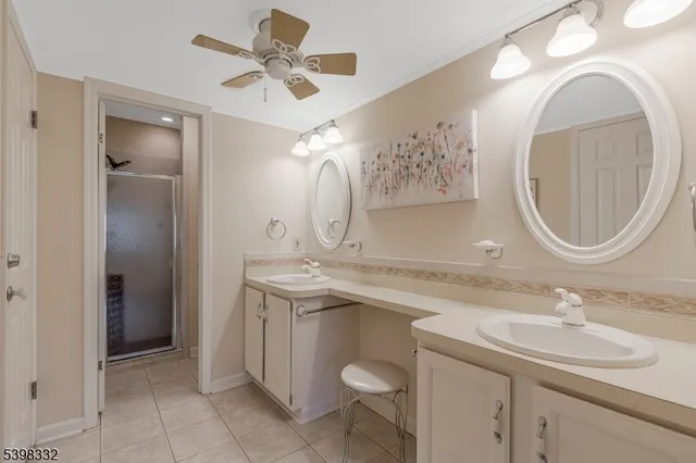 a bathroom with a double vanity sink mirror and