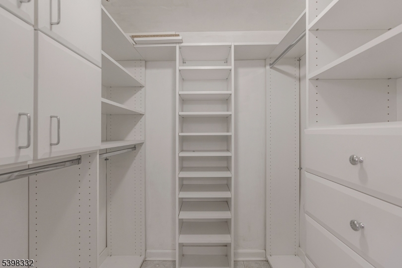 46 Eton Court Bedminster, NJ 07921 - Photo 18 of 30 a view of walk in closet with empty racks