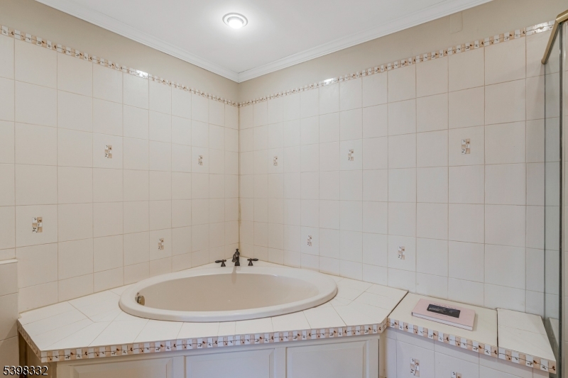46 Eton Court Bedminster, NJ 07921 - Photo 24 of 30 a bathroom with a sink and a mirror