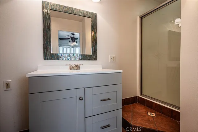 a bathroom with a sink a vanity and a mirror