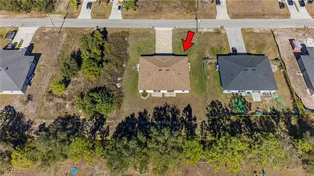 an aerial view of residential house with an outdoor space