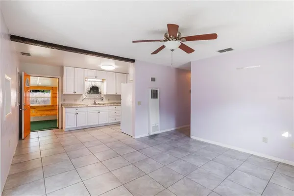 a view of a kitchen with a sink and dishwasher cabinets