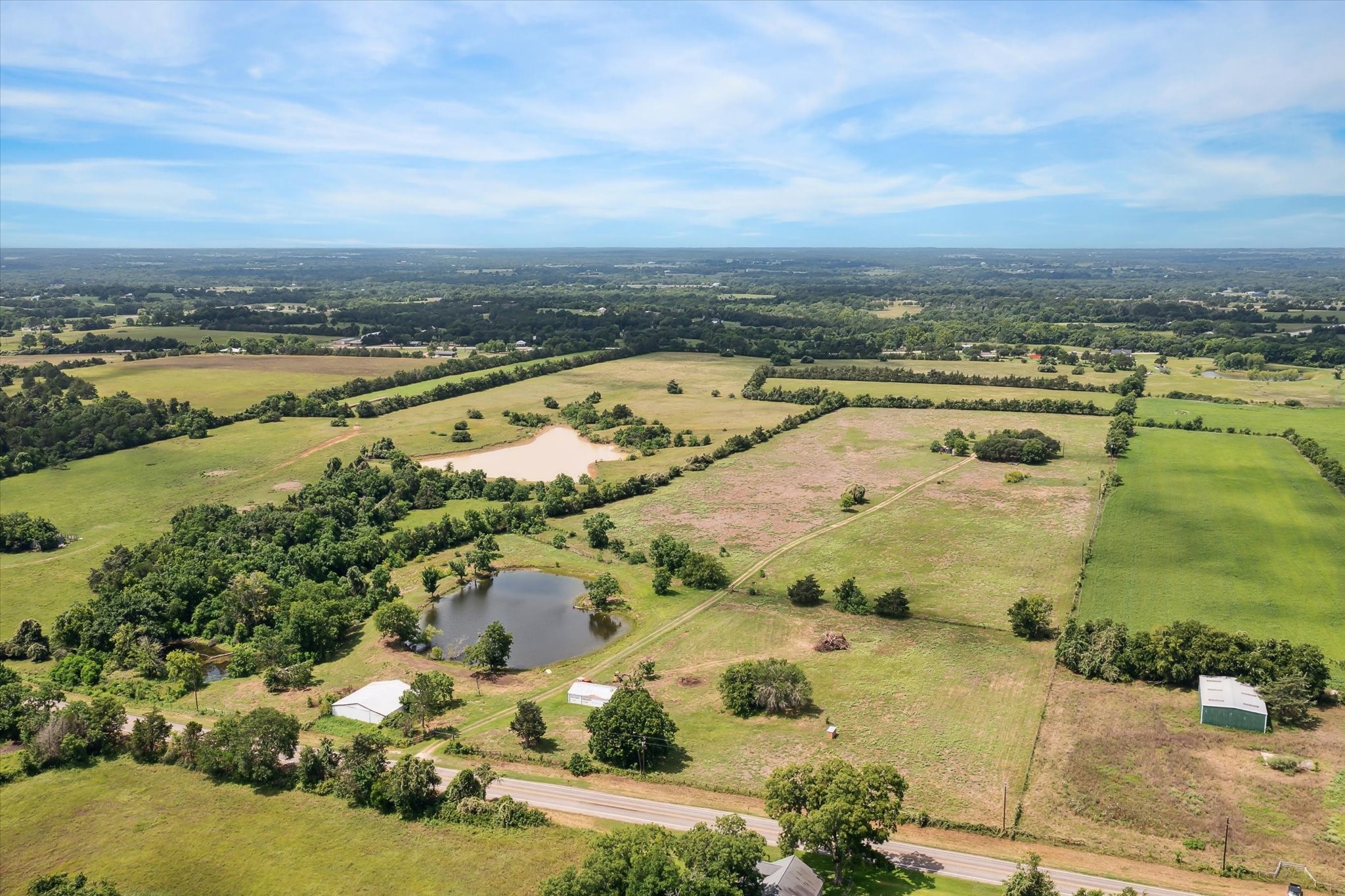 an aerial view of residential building and lake