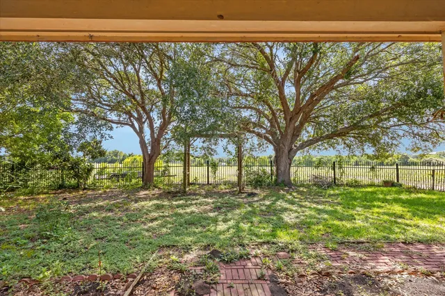 a view of a porch with wooden floor and outdoor space