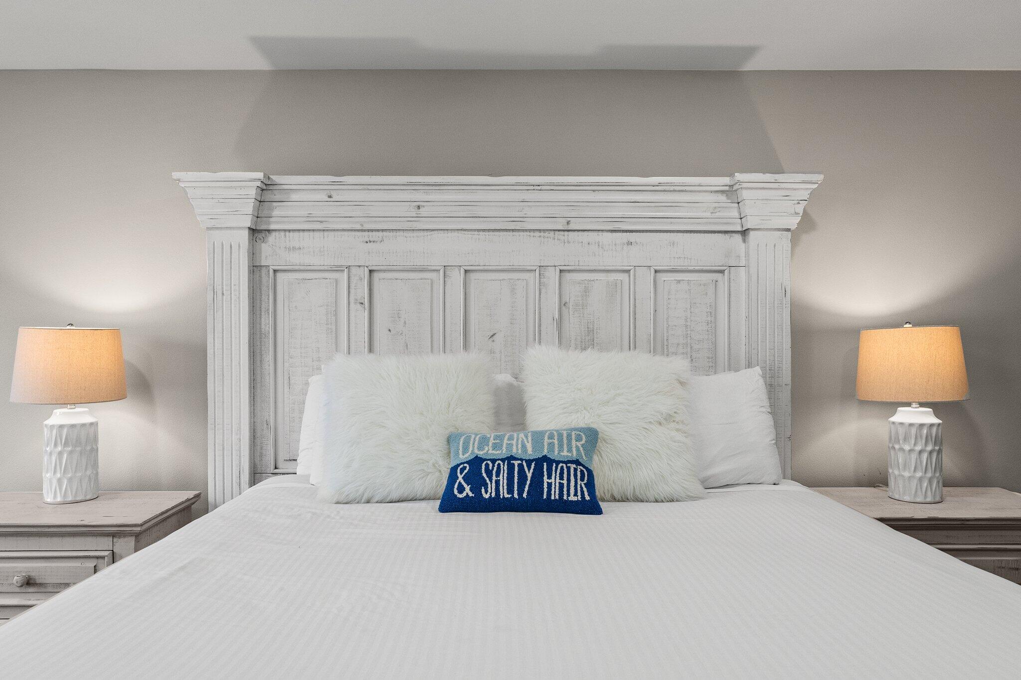 4455 Ocean View Drive Destin, FL 32541 - Photo 25 of 56 a bedroom with a bed and a night stand