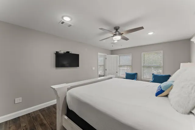 a bedroom with furniture and a window