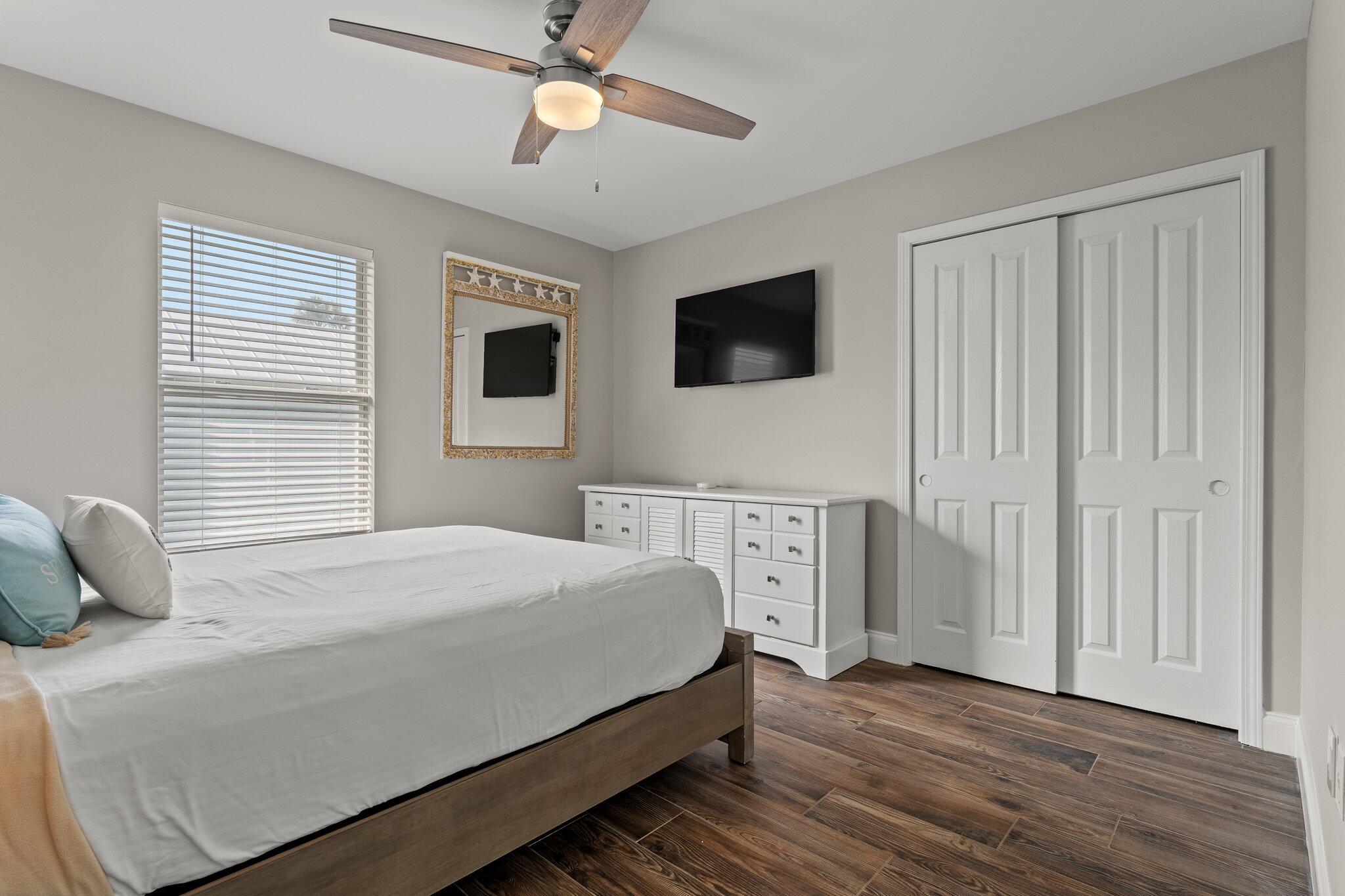 4455 Ocean View Drive Destin, FL 32541 - Photo 35 of 56 a bedroom with a large bed and a tv