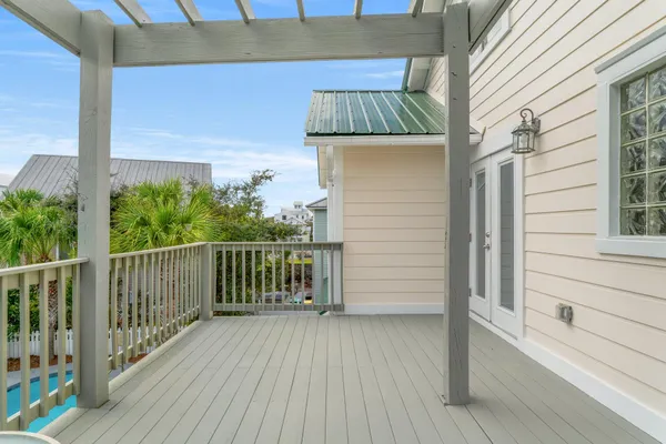 a view of balcony with wooden floor