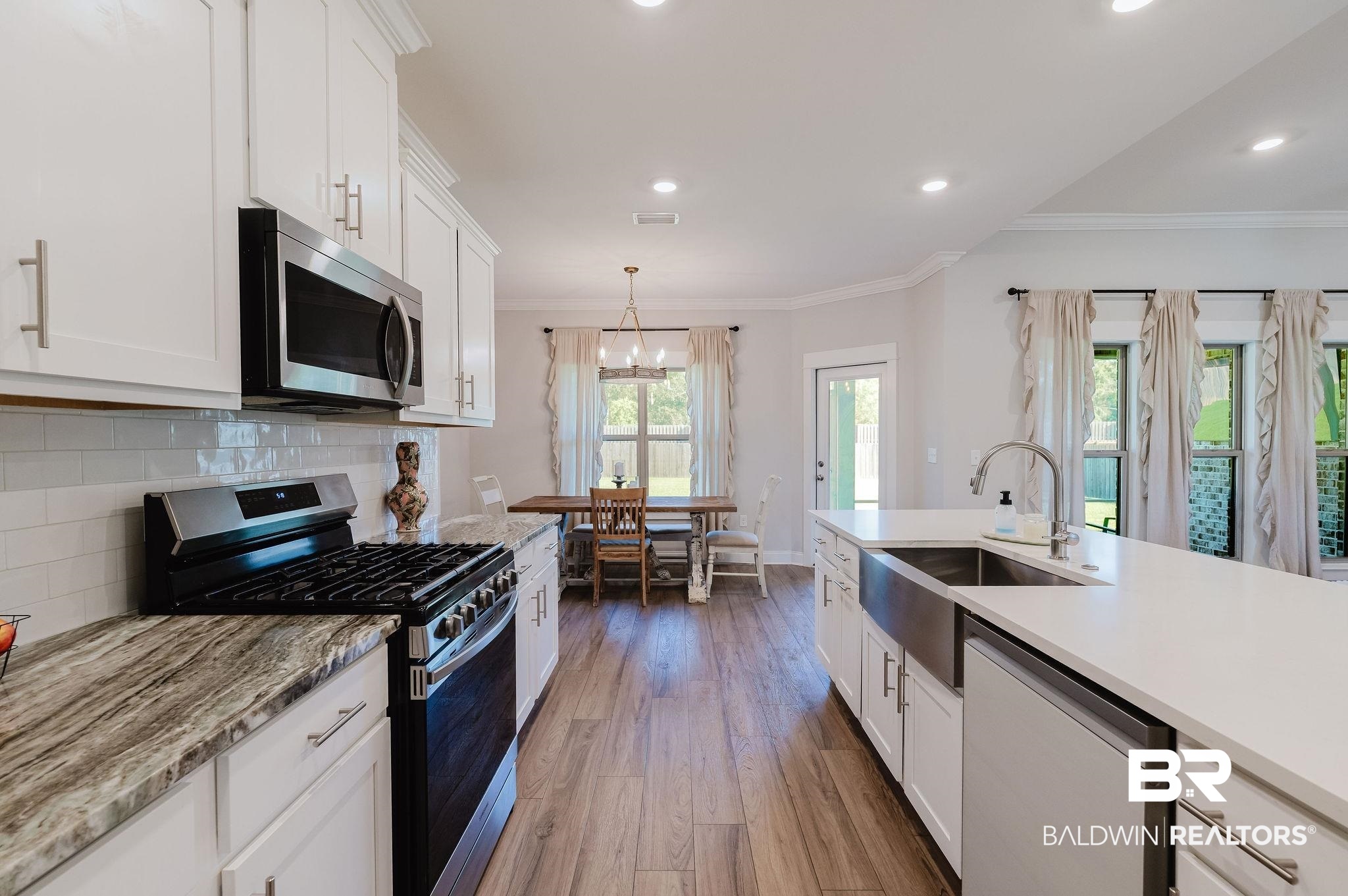 7872 Calverton Street Foley, AL 36535 - Photo 37 of 76 Modern kitchen featuring a stainless steel gas range, microwave, and dishwasher
