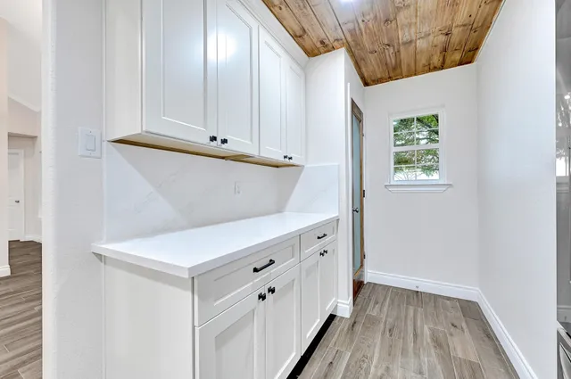 a view of room with wooden floor