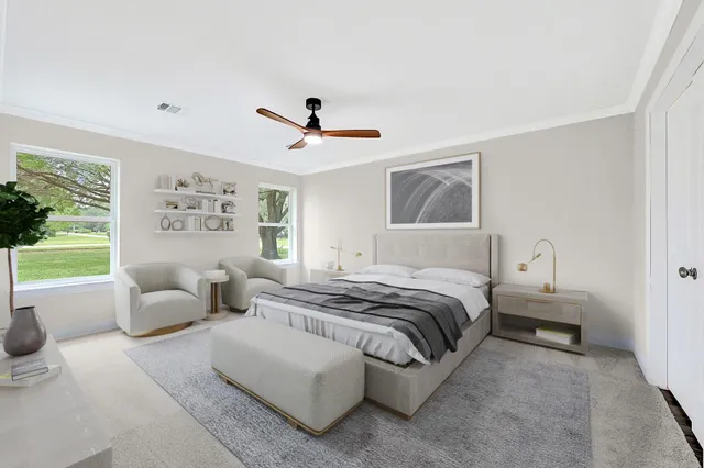 a spacious bedroom with a bed and a couch