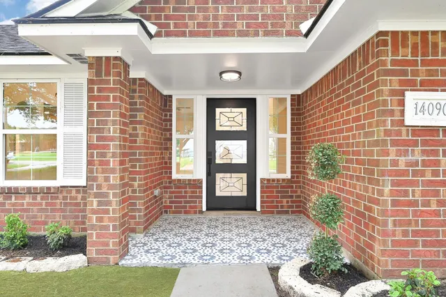 a view of a door of the house with a street