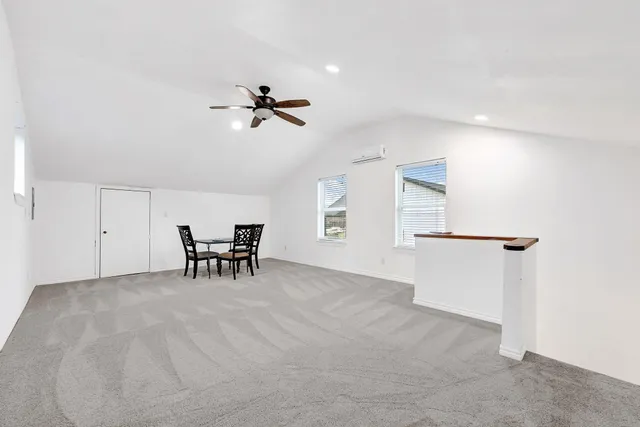 a view of a livingroom and a ceiling fan