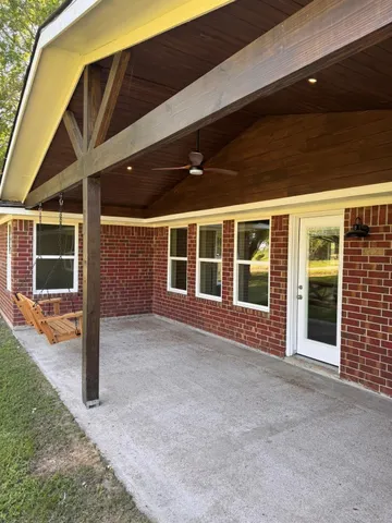 a room with sliding door and wooden floor