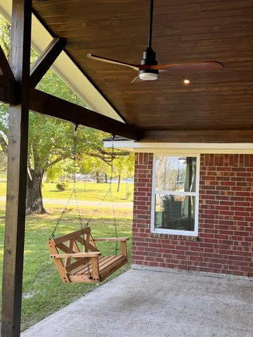 a view of house with a yard